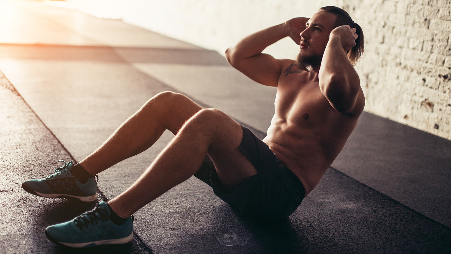 man doing abdominal exercise in gym