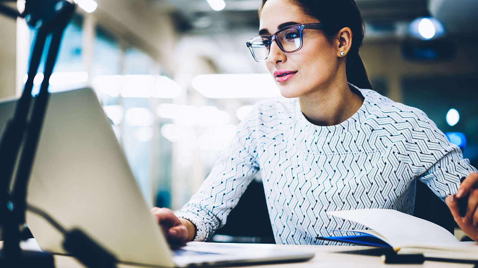 young female designer working on a laptop