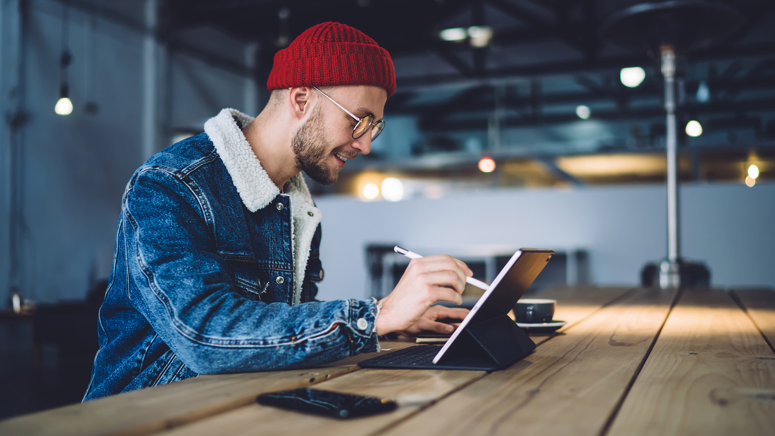 Male designer working on tablet device in office environment