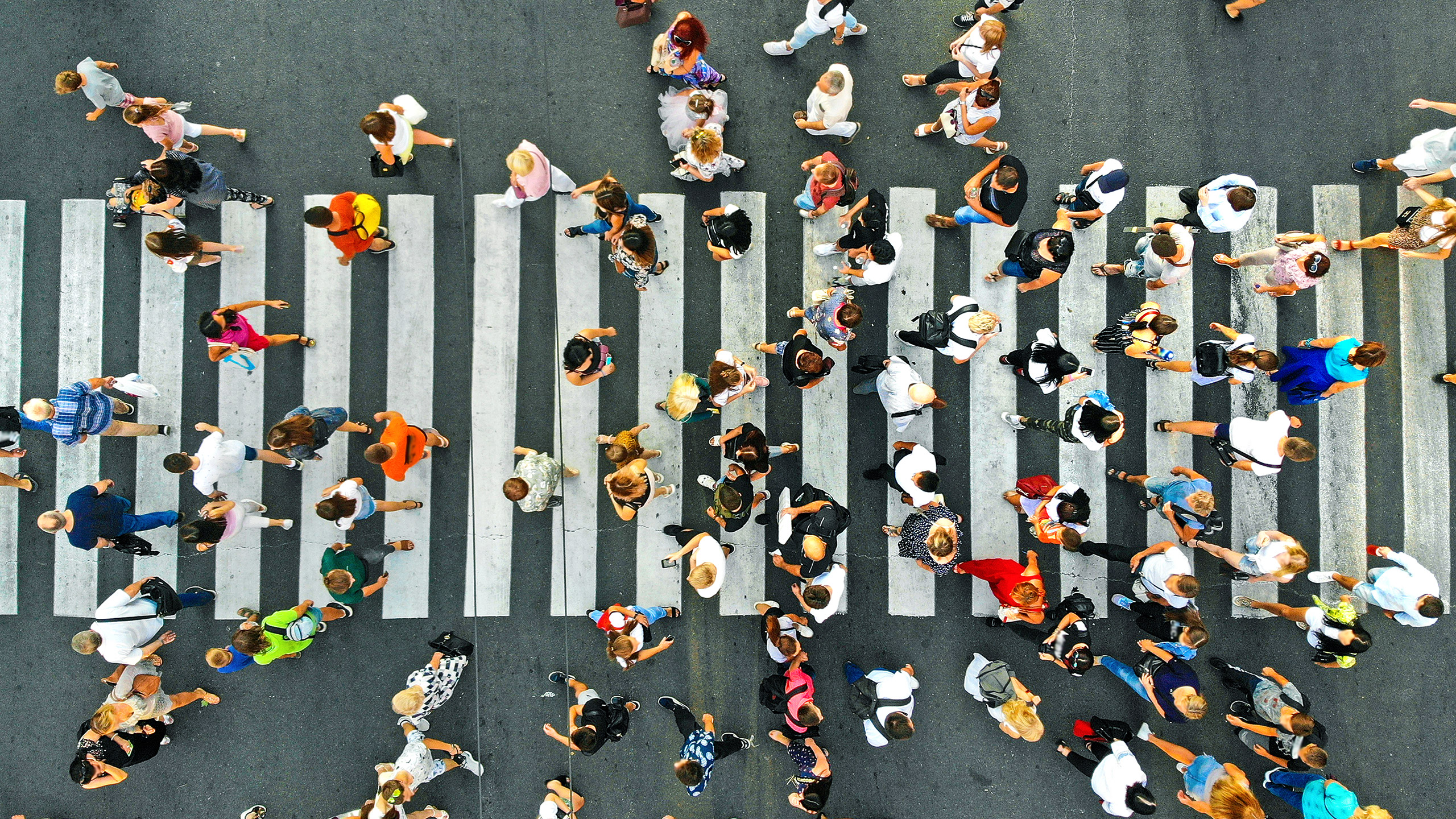 Top down view of crowd on a cross walk