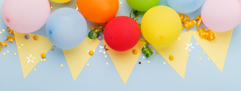 Hanging balloons and yellow party banner