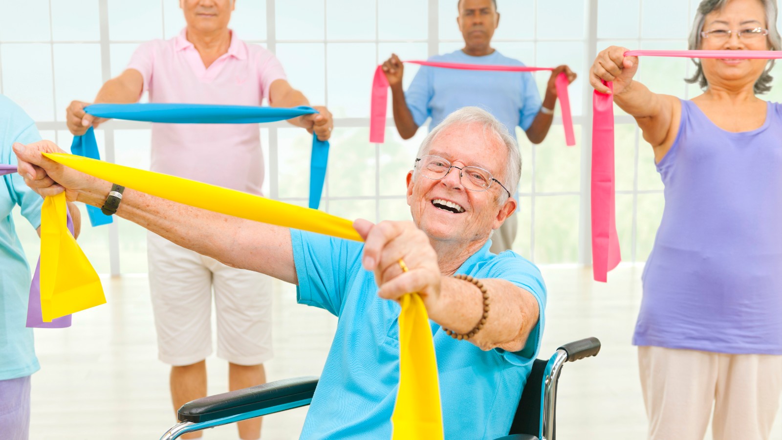 Fitness class including a man in a wheelchair