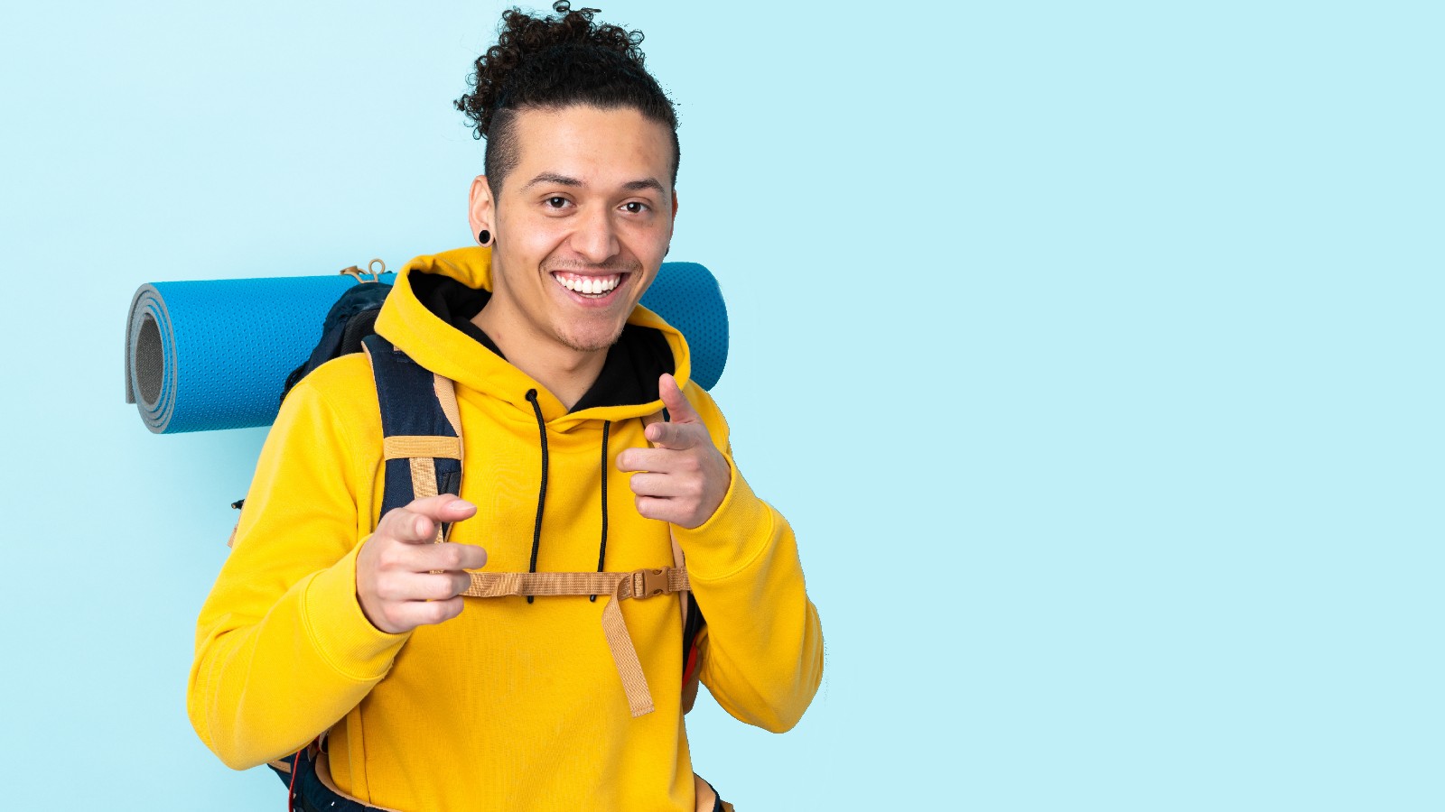 Man dressed for hiking and camping