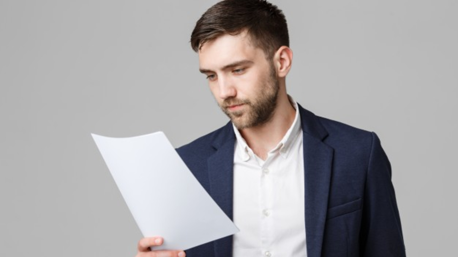 Young man reading report