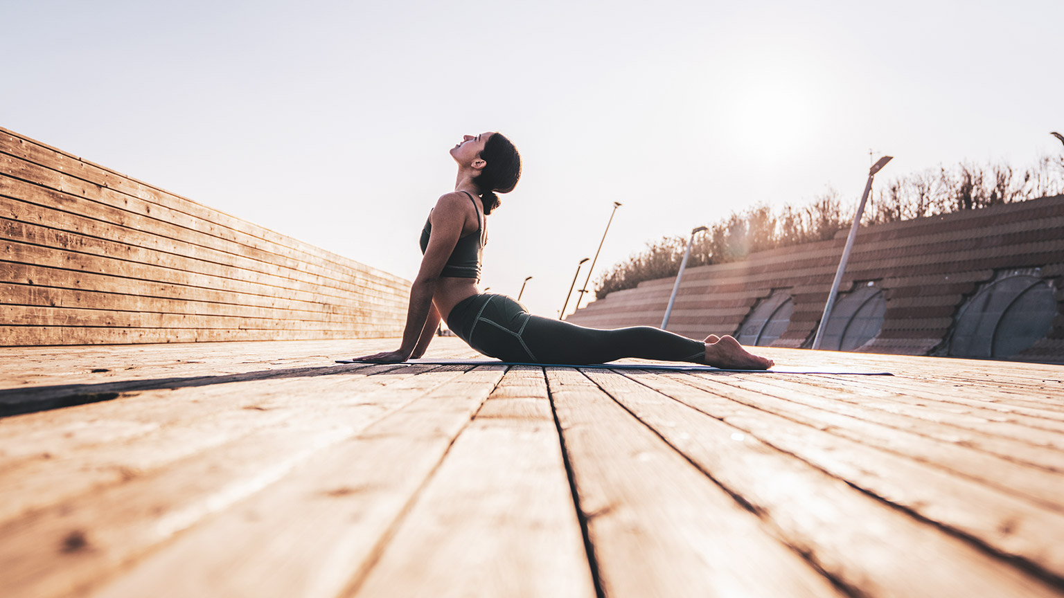 woman doing yoga outside