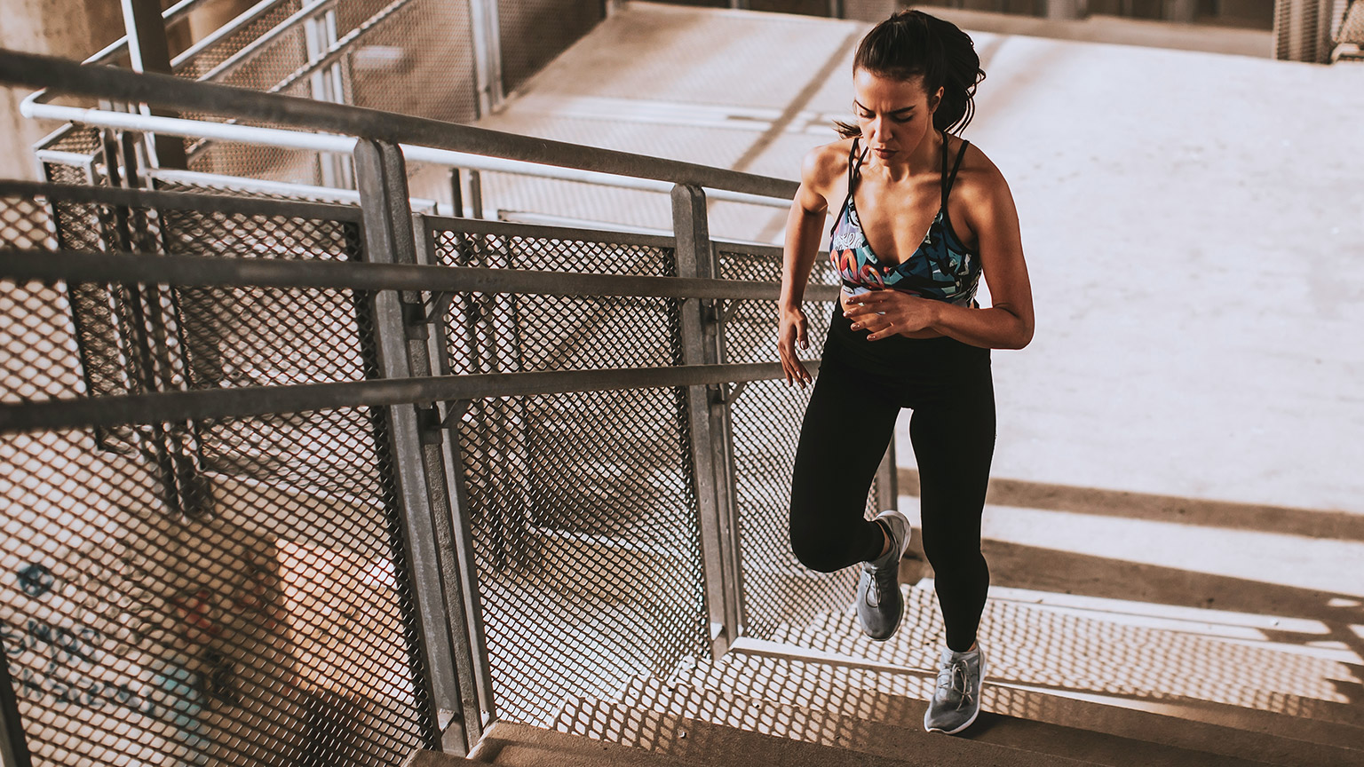 Woman running up stairs