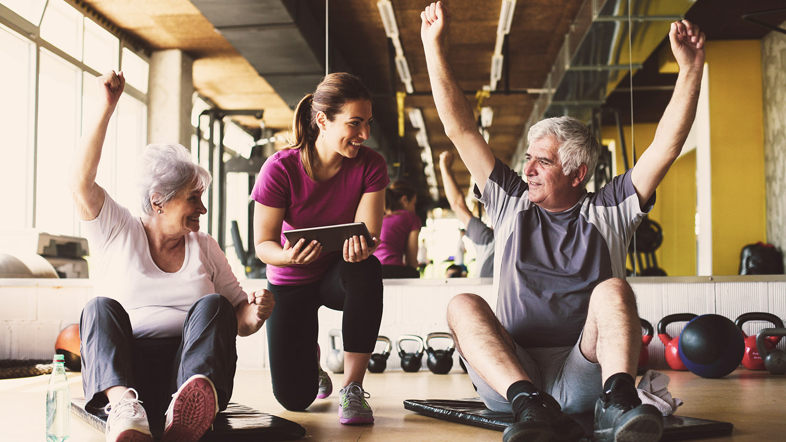 Female trainer with senior clients