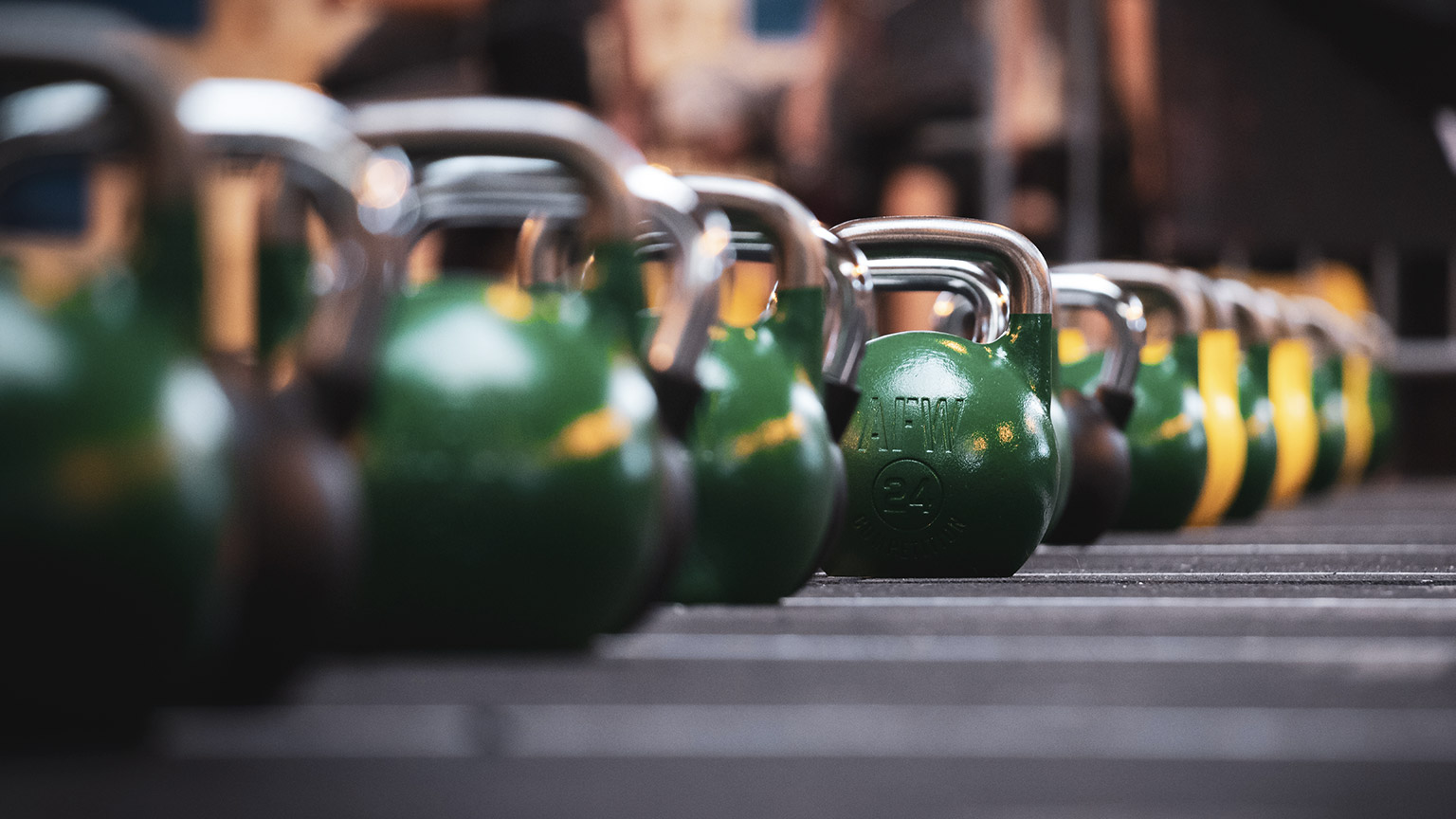 Line up of kettle bells in gym