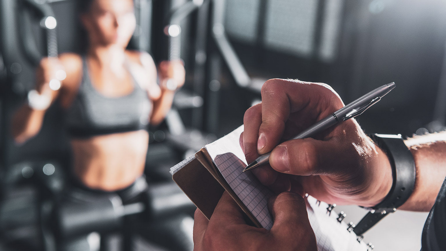 Trainer writing on notebook