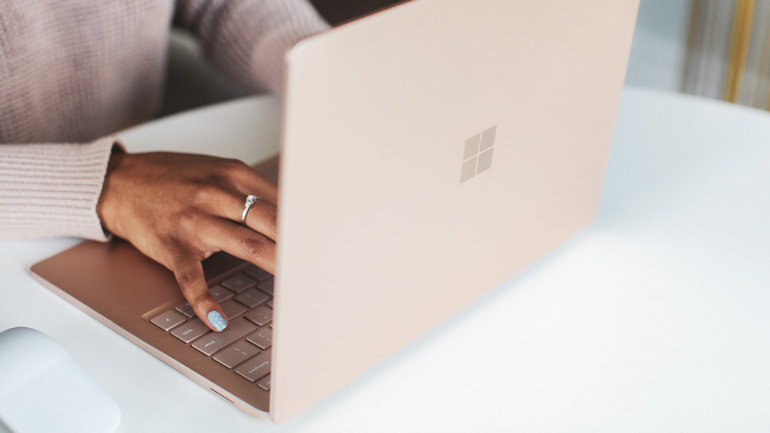 A close view of an employee typing up an incident report on a laptop computer