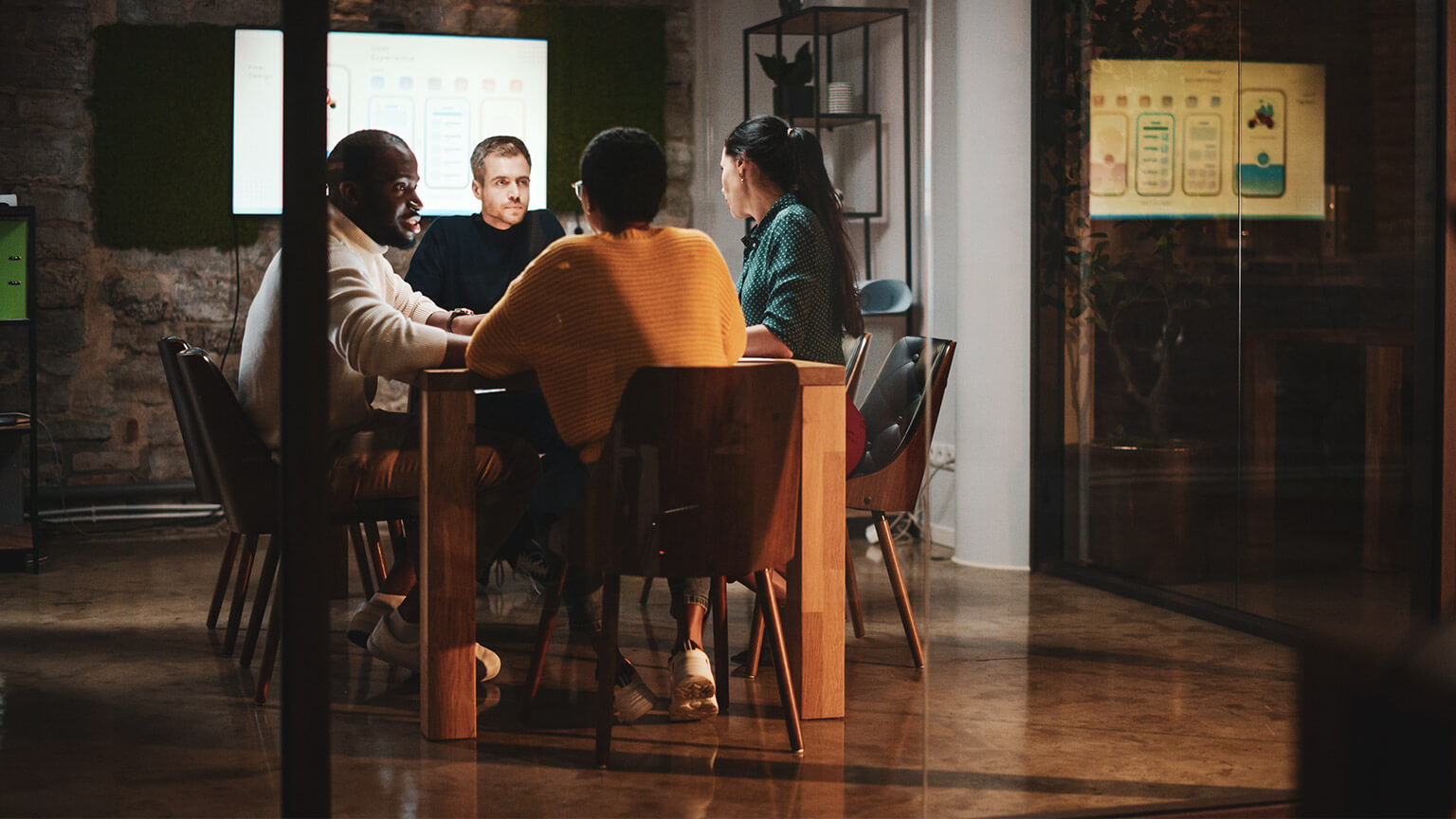 A group of business people sitting in an office discussing marketing topics