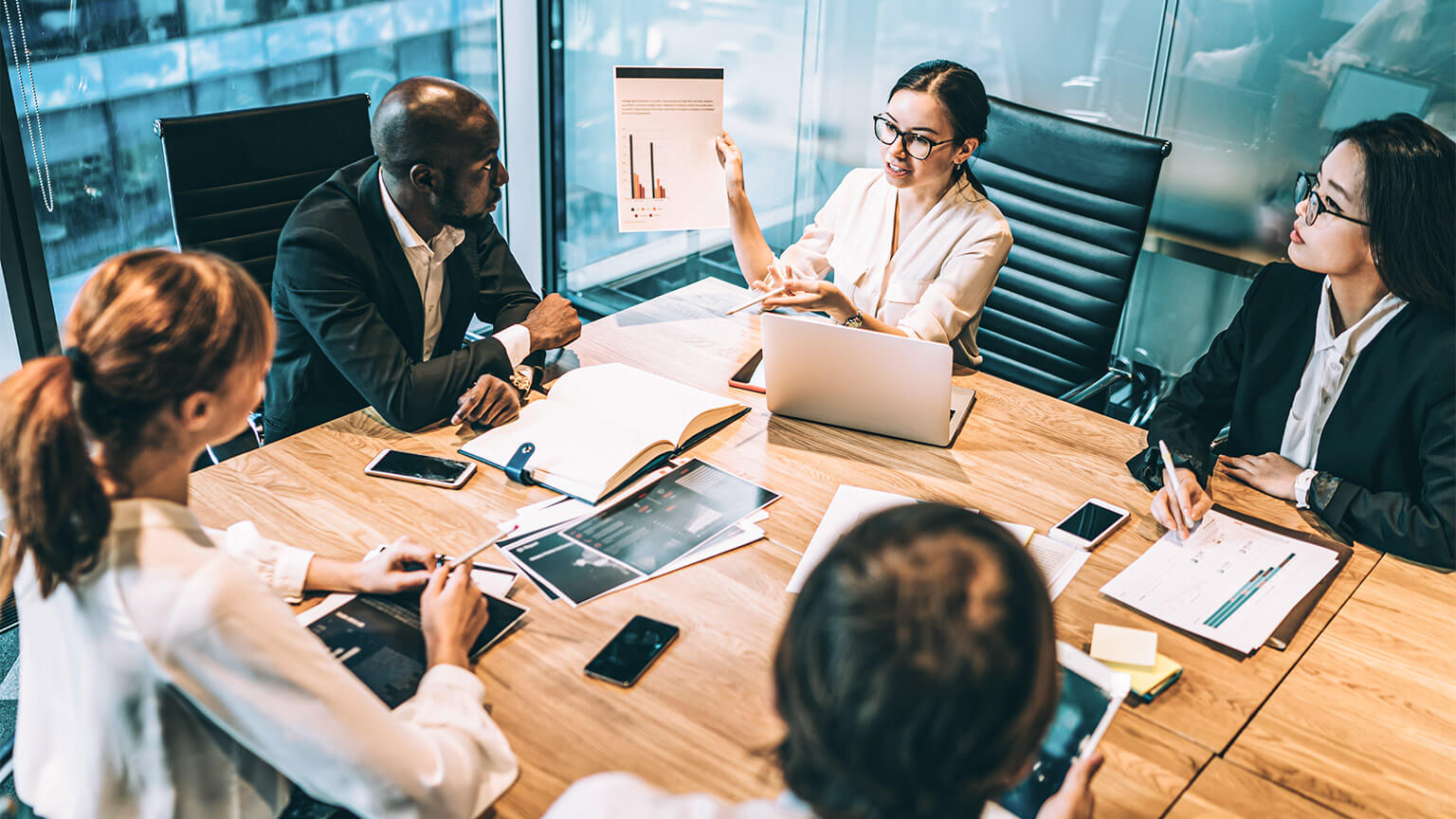 A small team holding a planning session in the boardroom