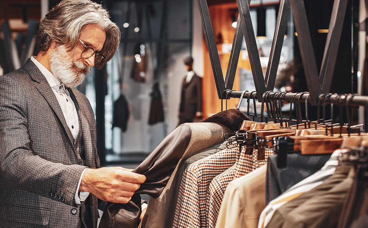 A mature gent examining his next suit purchase