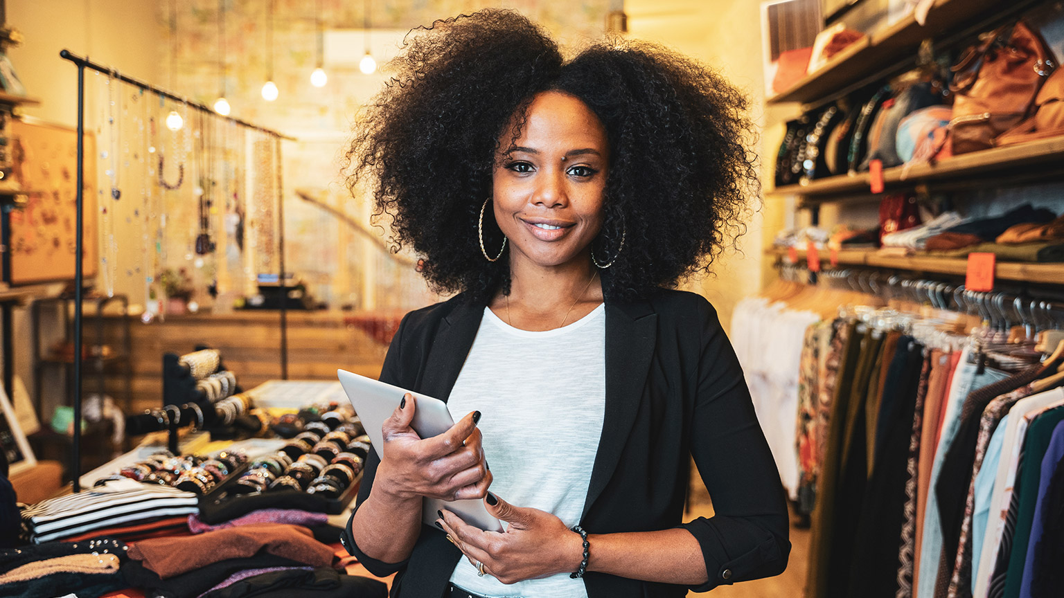 A young successful entrepreneur standing in her store