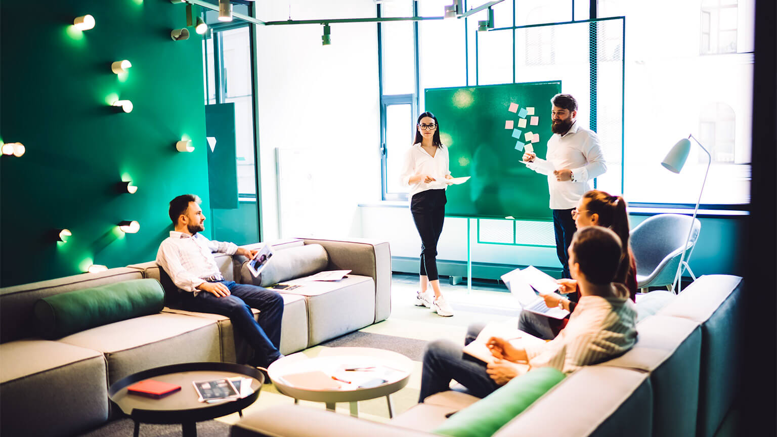 A team holding a meeting, putting together a plan for their next project