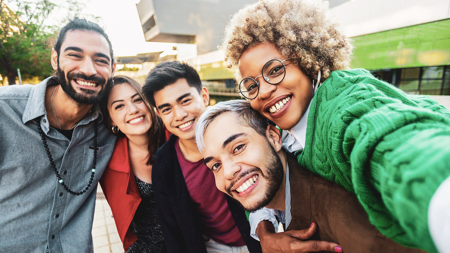 A group of diverse youth workers smiling at the camera