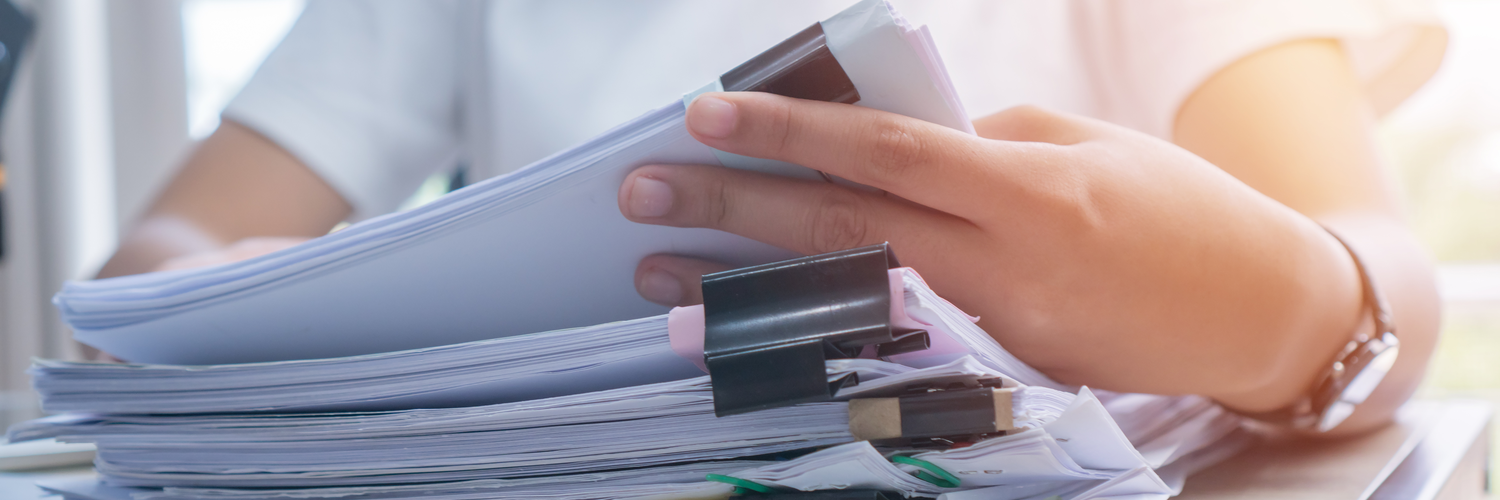 Employee woman hands working in Stacks paper files