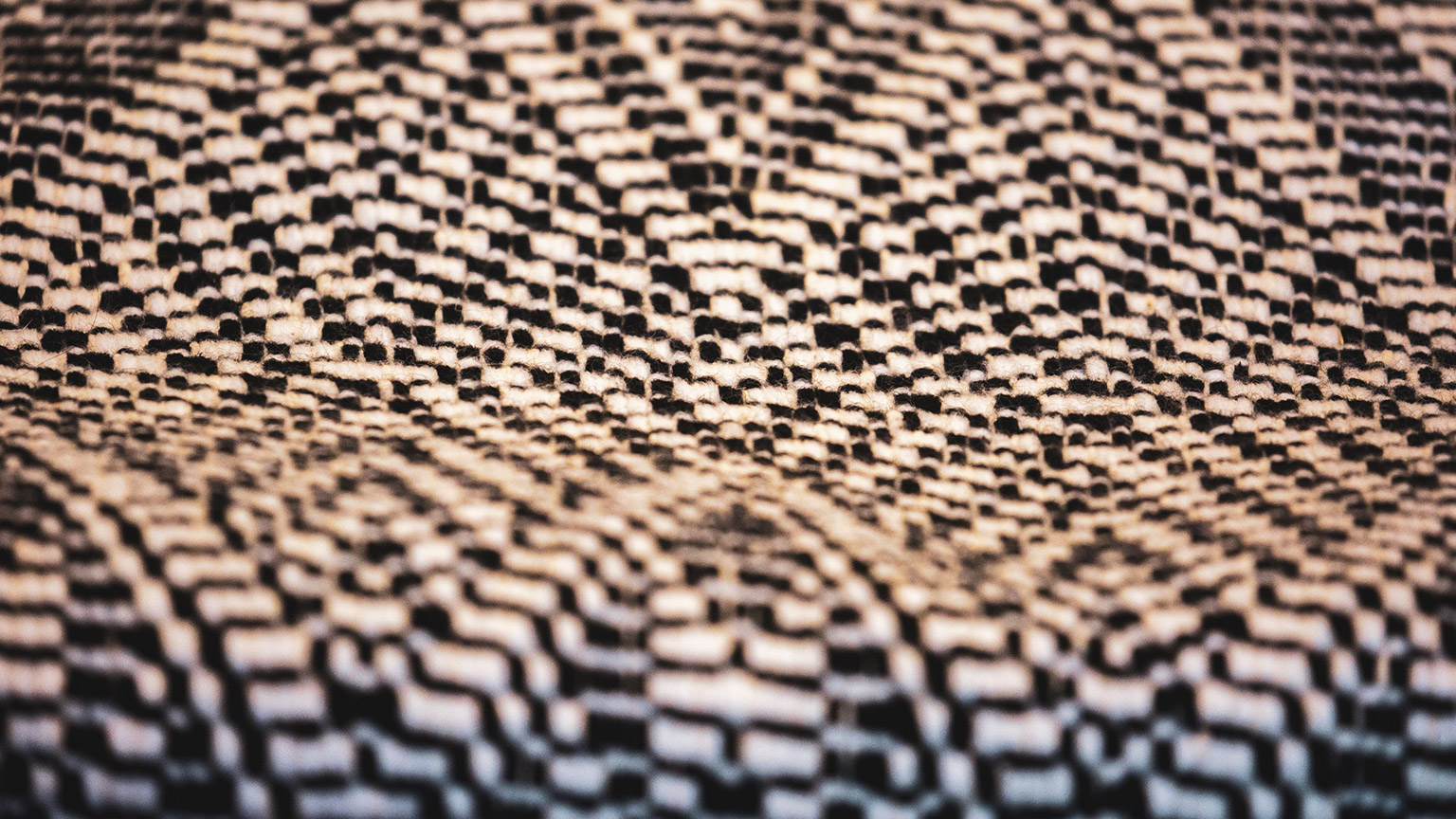 A detail shot of a traditional maori mat weaving