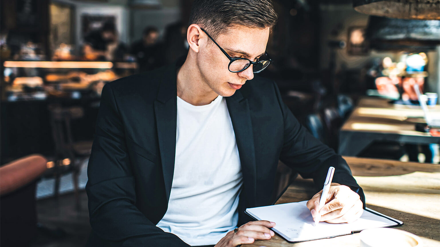 A young professional adding a meeting to their busy schedule