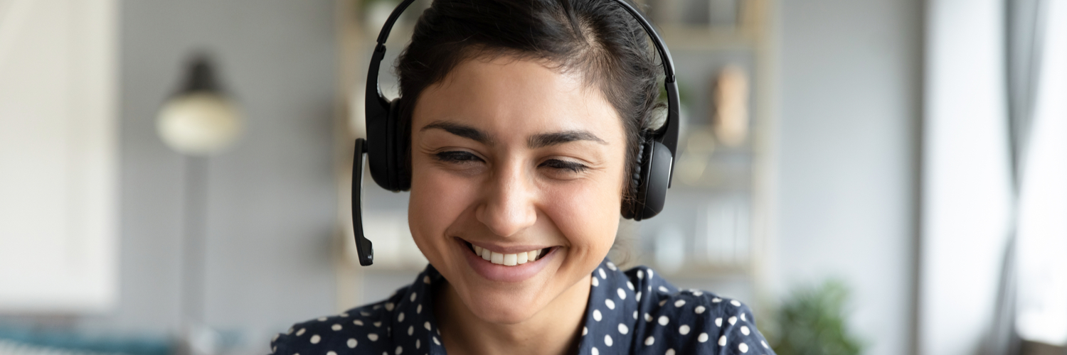 Support person on a phone call to a student