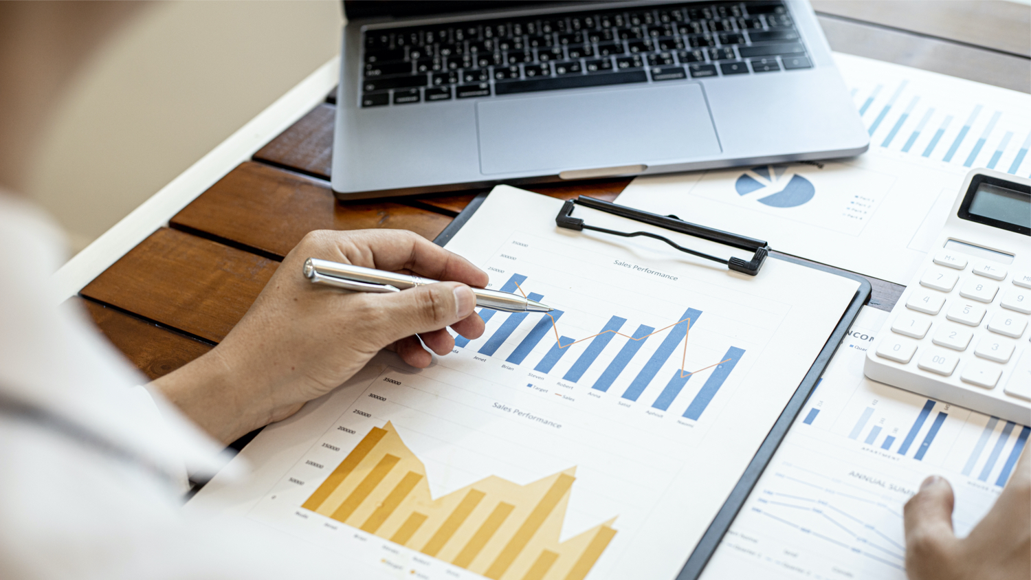 A financial businessman examines the financial information of the company, he receives documents from the finance department and sends them for verification before presenting them to the meeting.