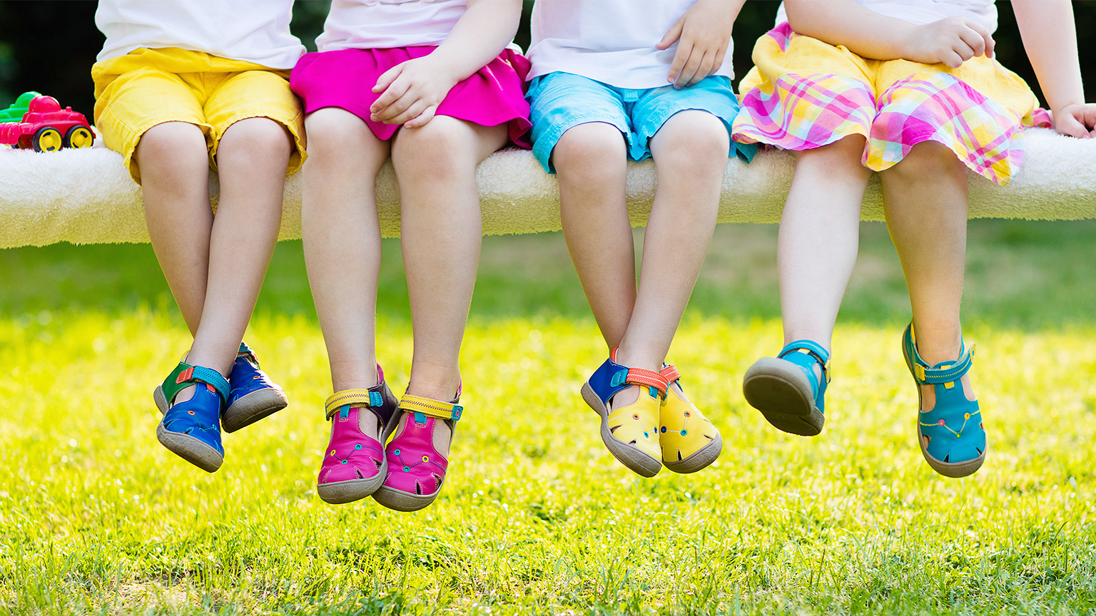 children's feet hanging off a bench