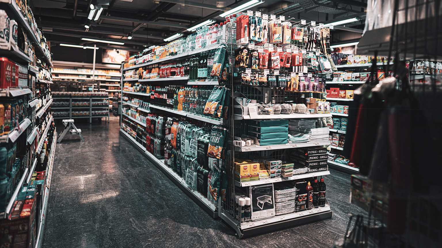 A wide shot of a modern supermarket