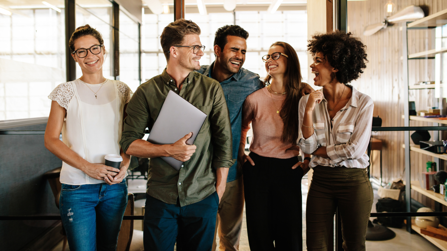 A successful business team standing together and smiling.