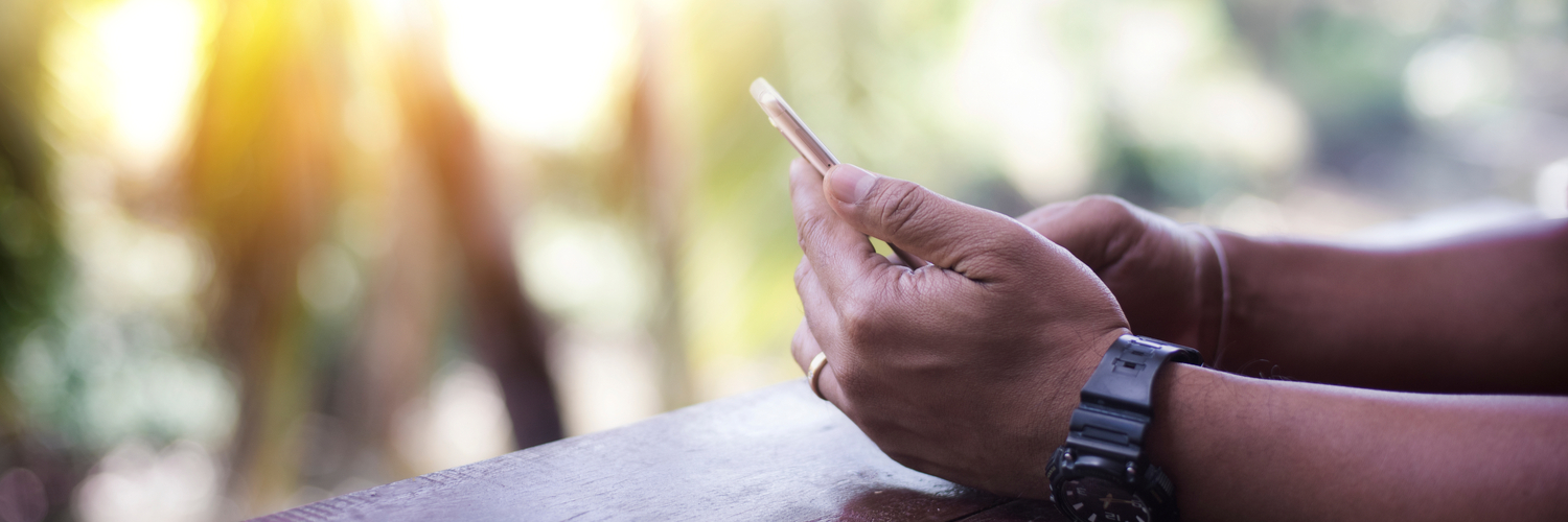 Man on a mobile device accessing learning 