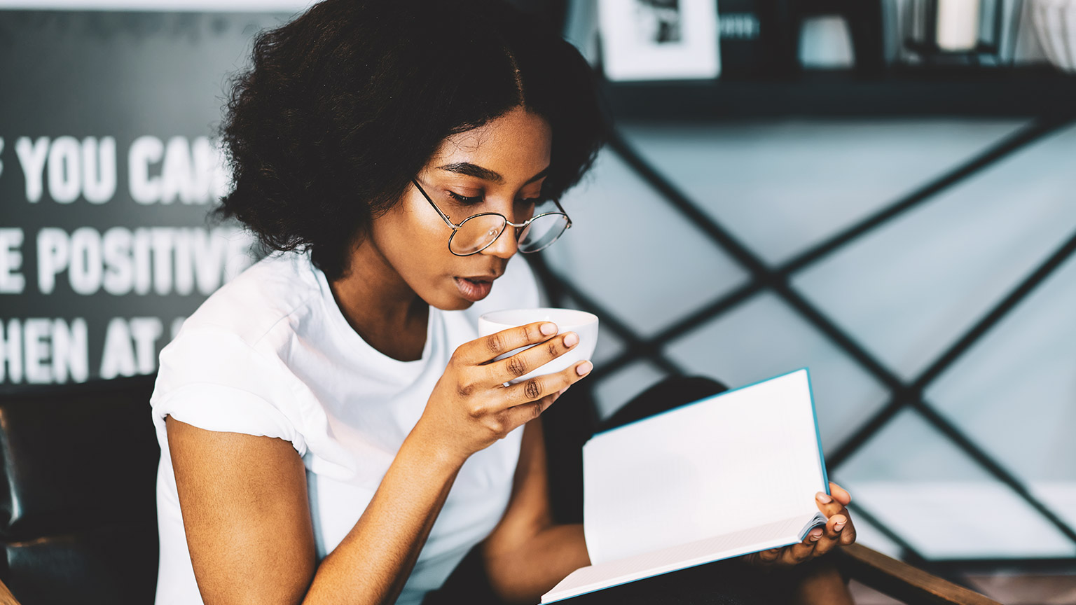 A person absorbing reference materials in a relaxed environment