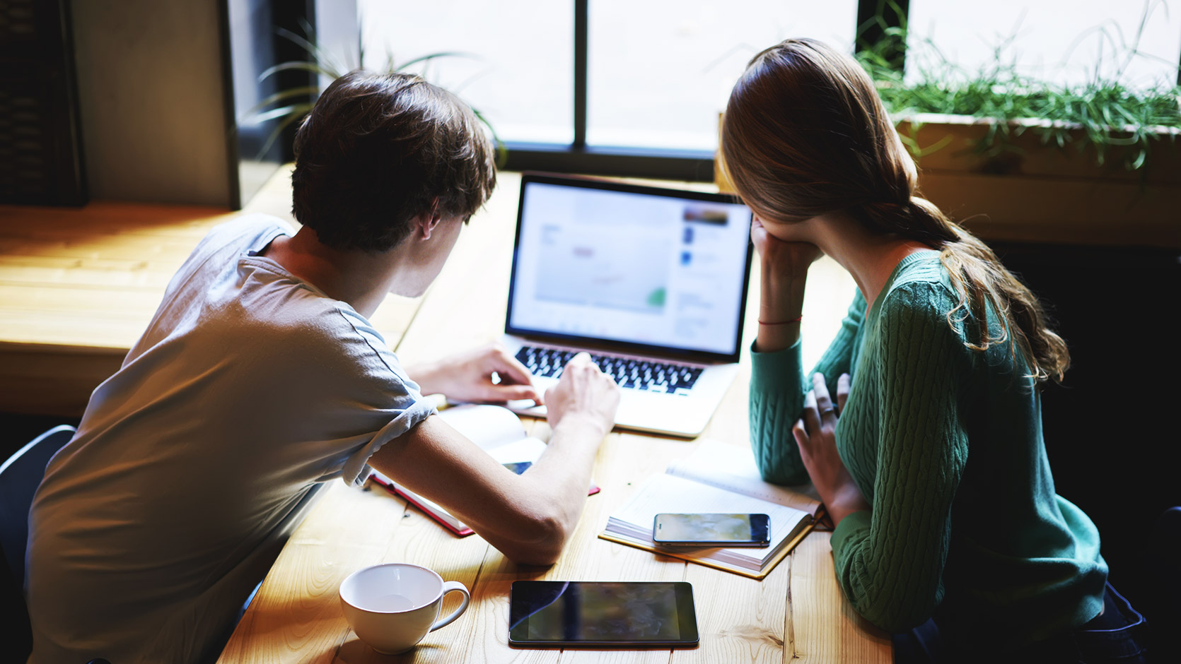 two people sharing information they've found on the internet