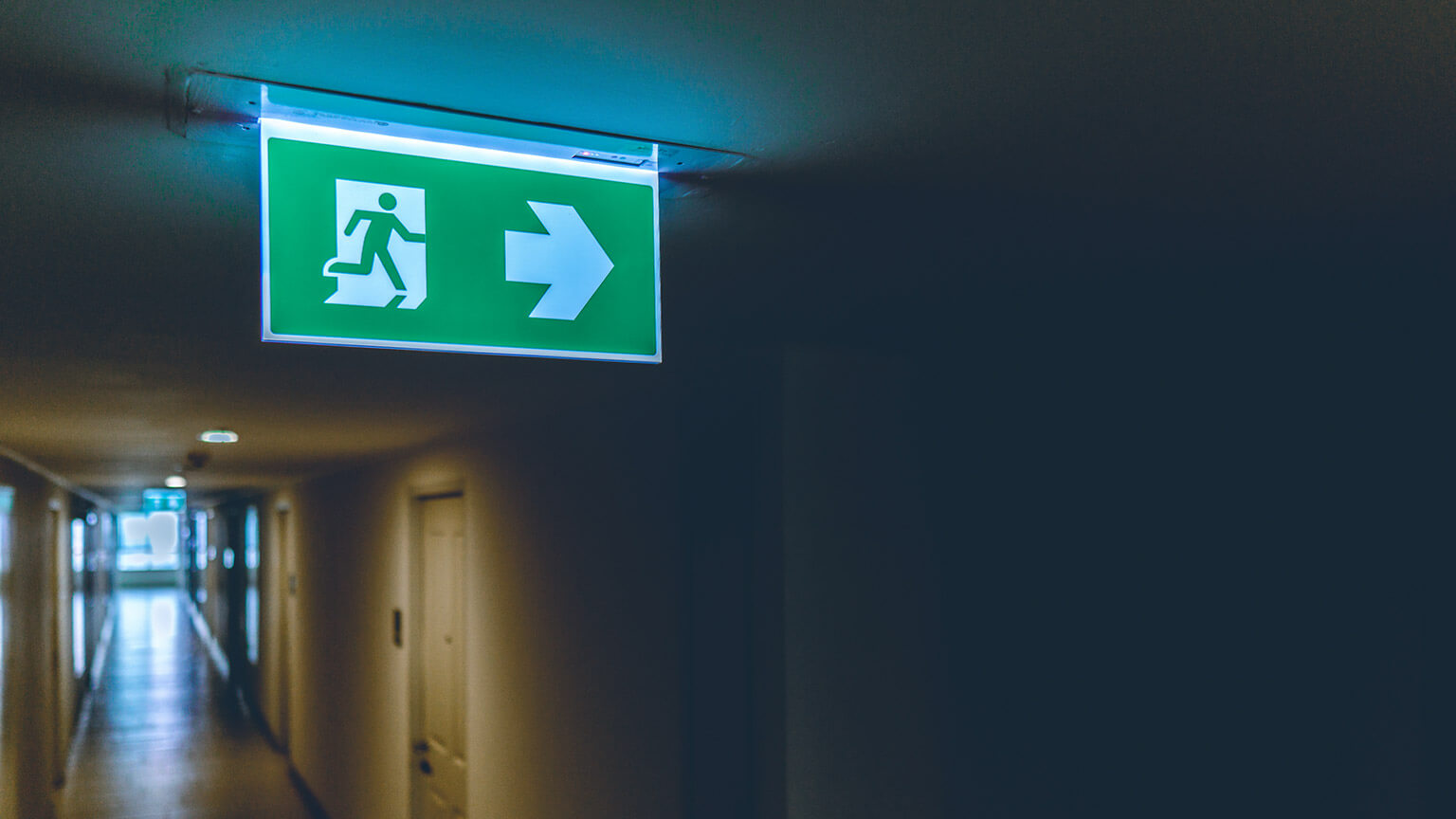 A close view of an emergency exit sign in a business