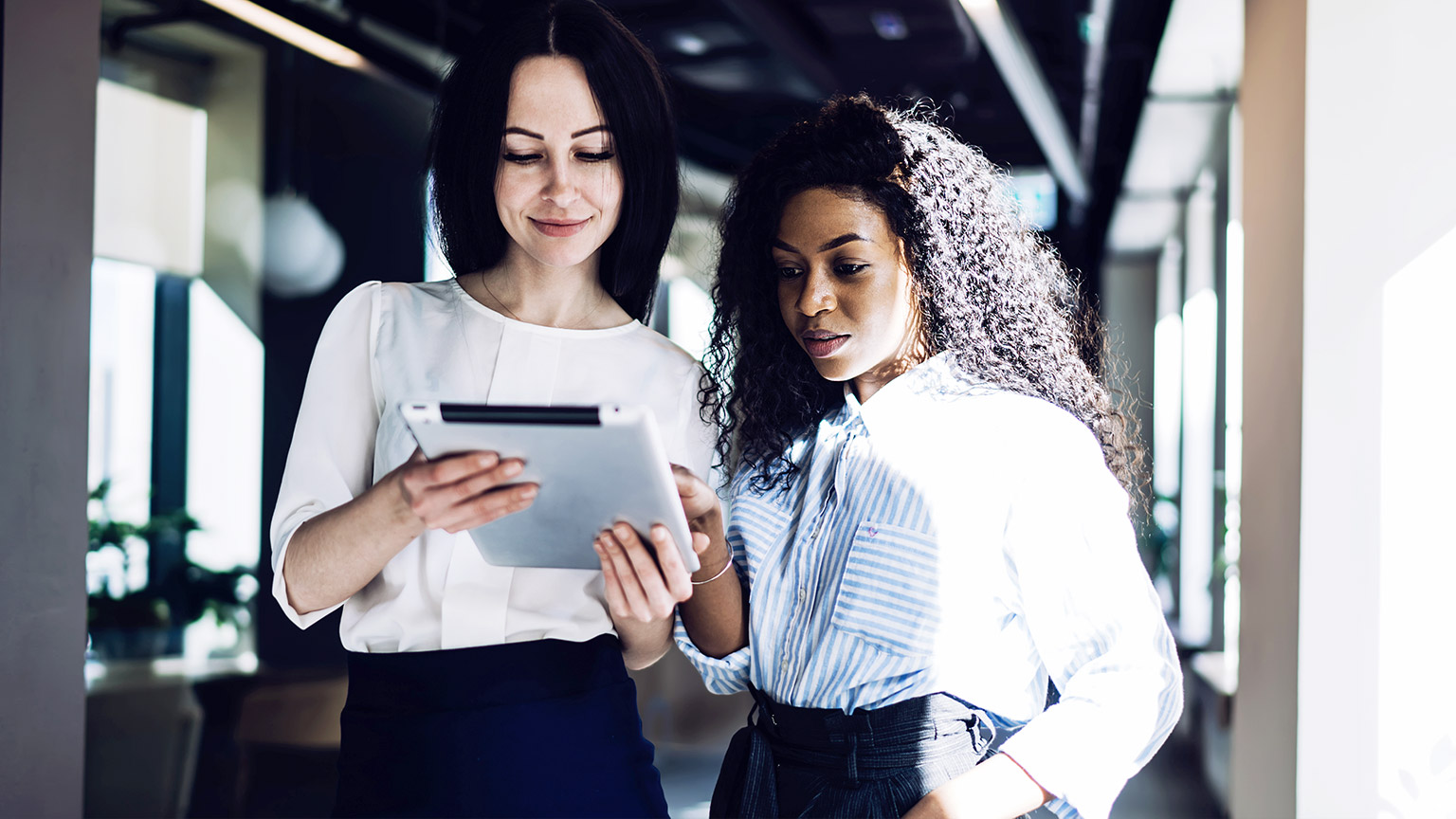 two colleagues developing a financial plan