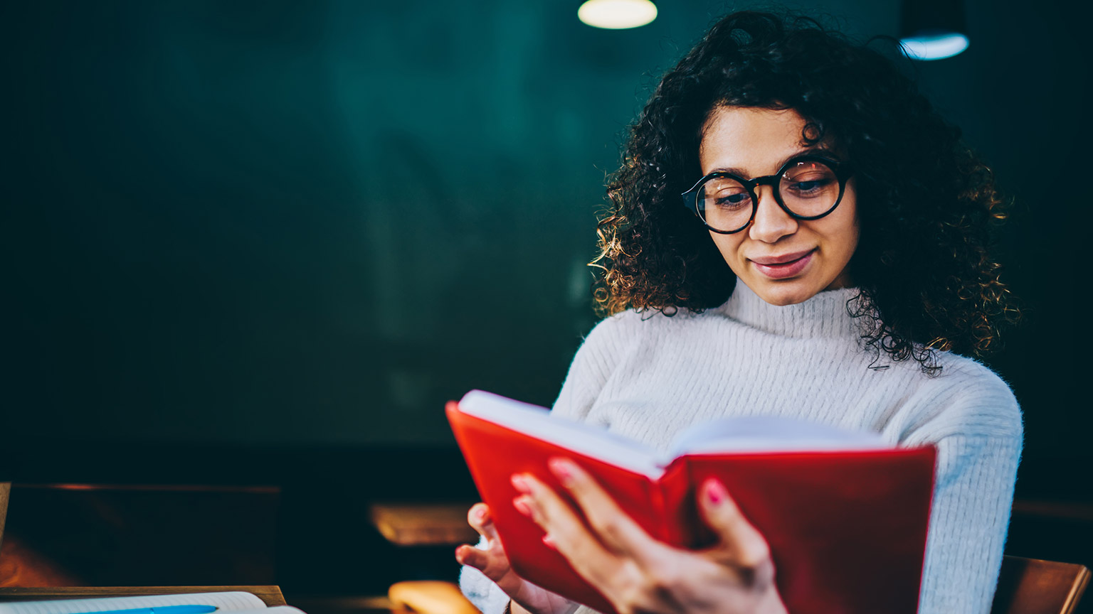 A student reading some reference material relating to the course of study