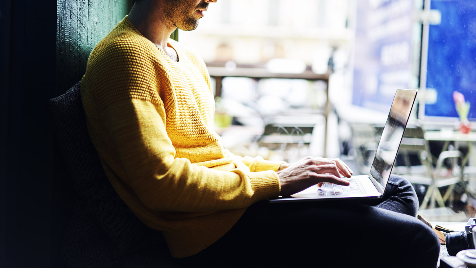 a person researching on their laptop