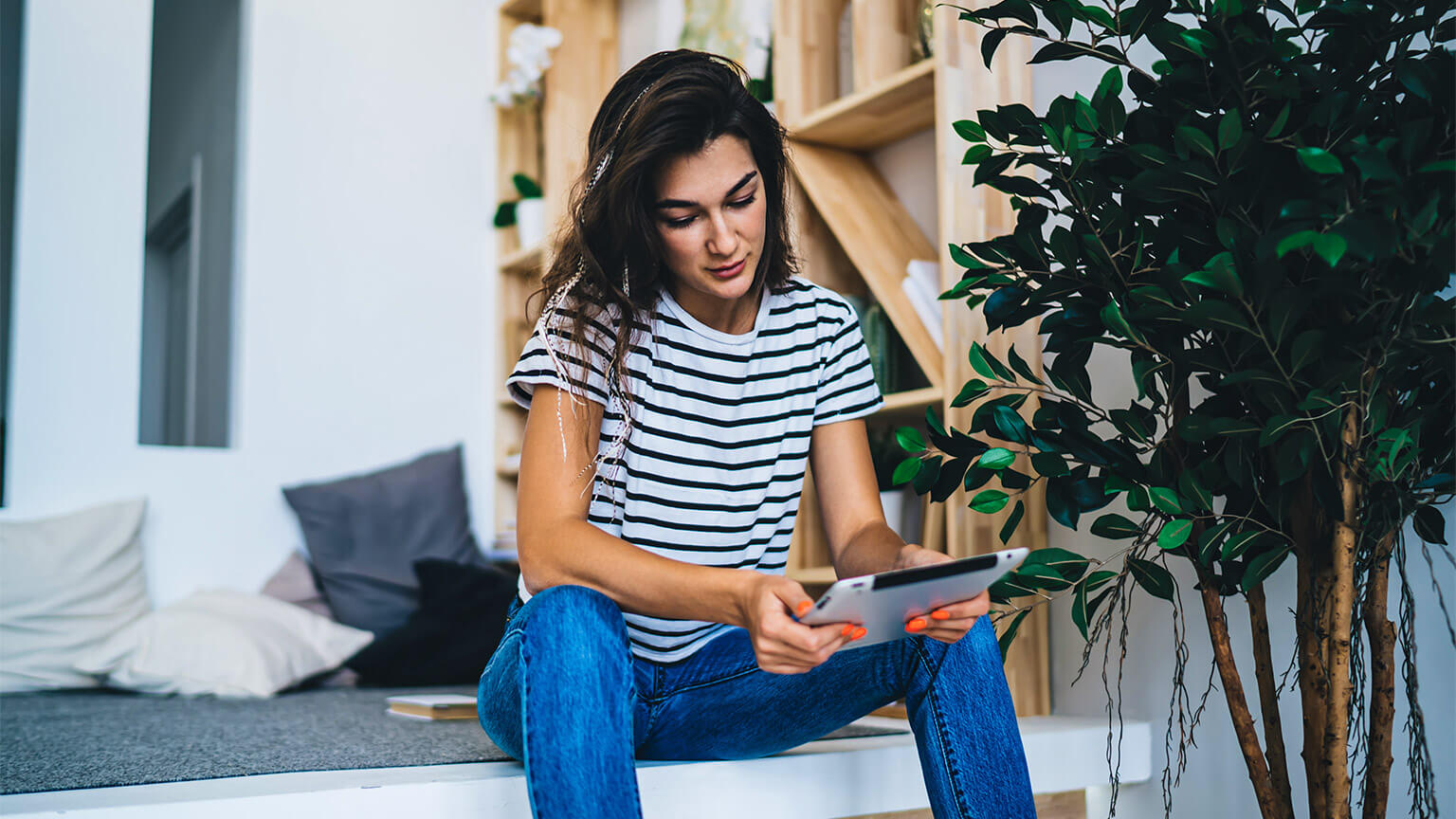 A student absorbing learning materials on their tablet device