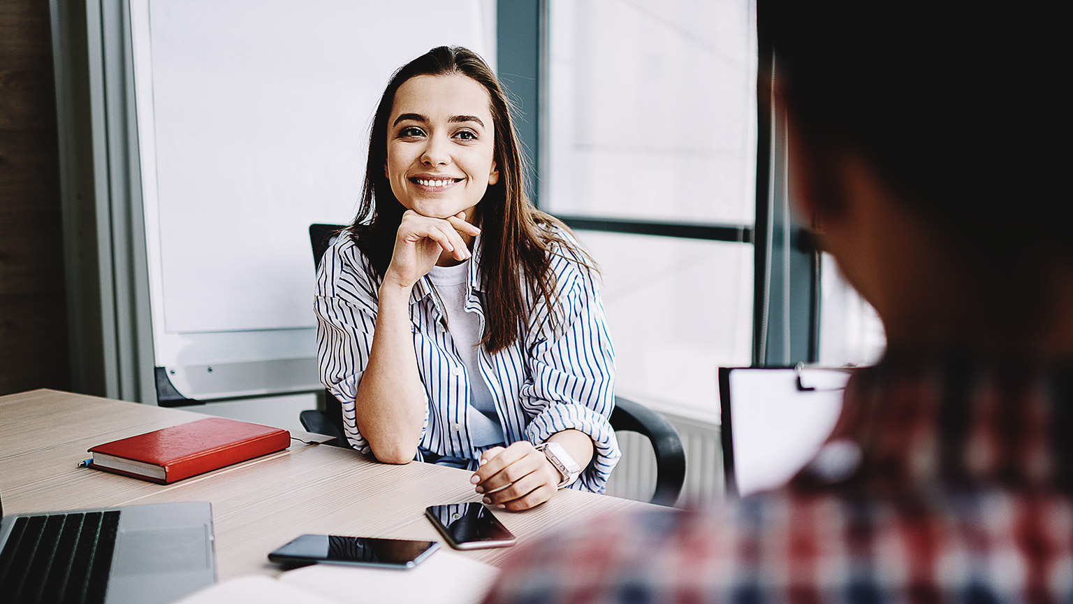 A relaxed person listening happily in a conversation