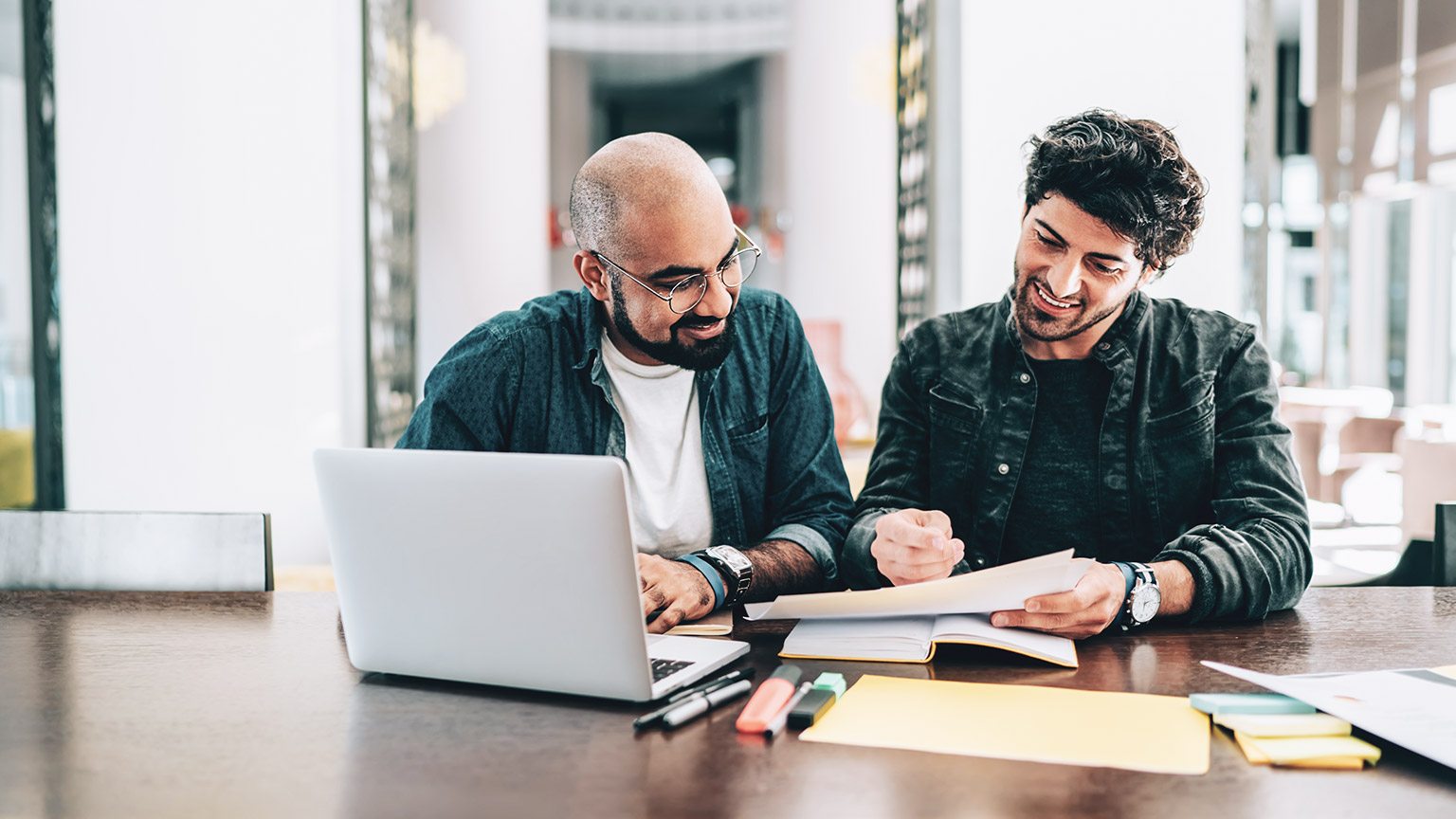 A BAS agent and client  discussing finances