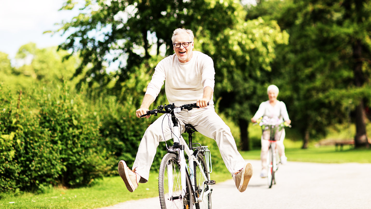 elderly people riding bikes