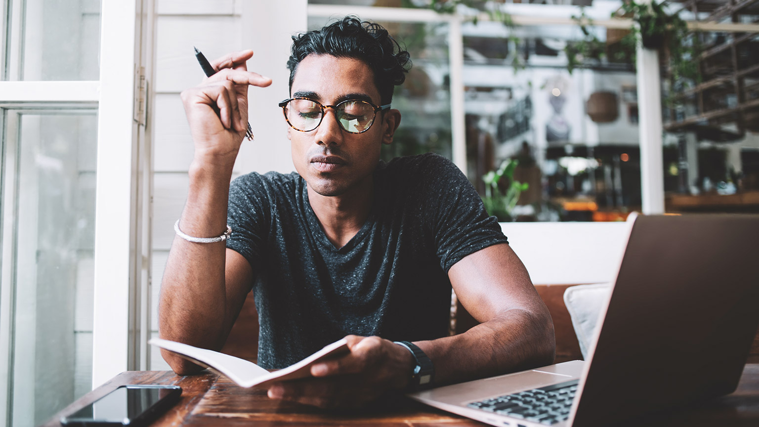 A young marketing person working on a project in a modern office space