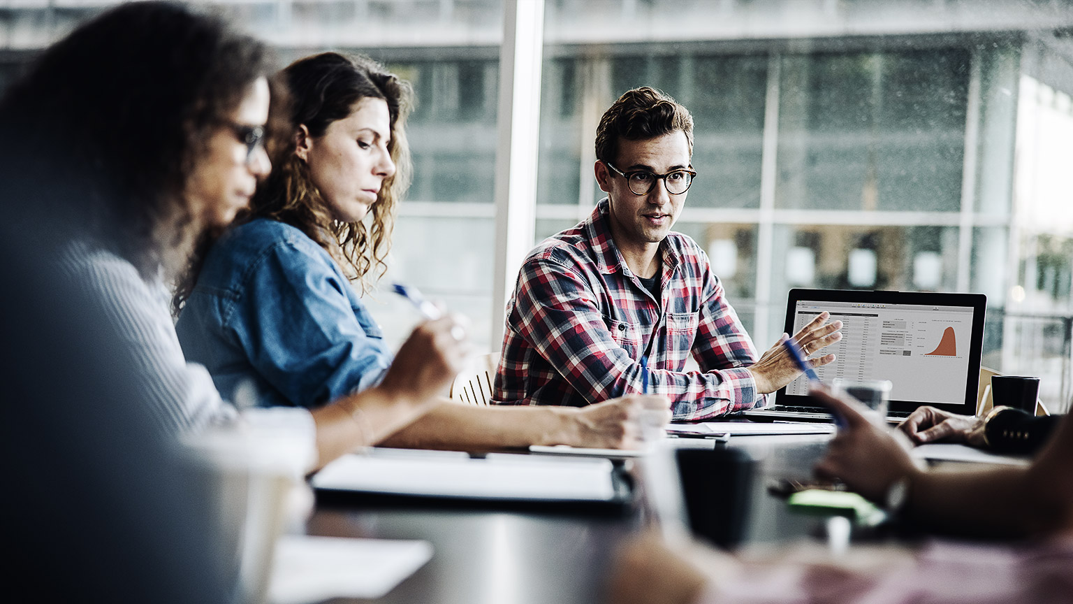 A group of employees discussing something very important