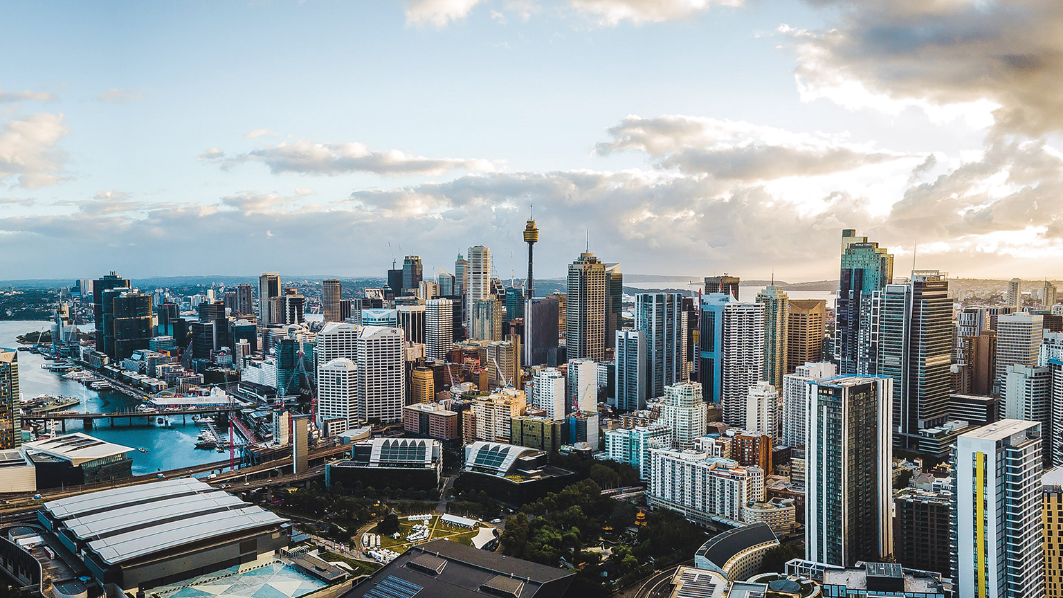 A wide view of Sydney skyline at sunrise