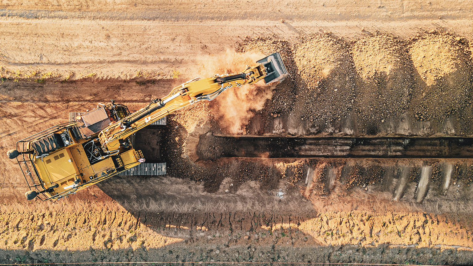 A top down view of an excavator working on site