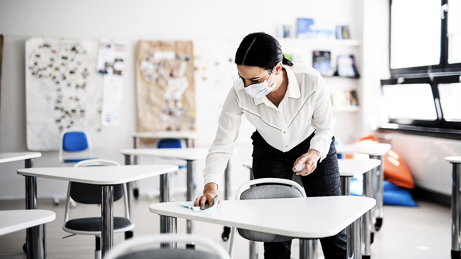 An early childhood professional cleaning class tables