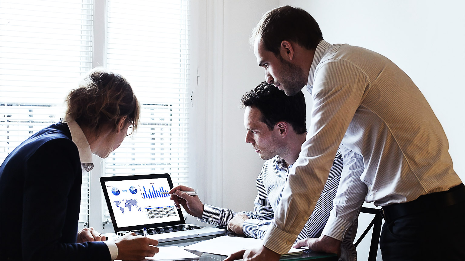 A team of data analysts reviewing big data captures