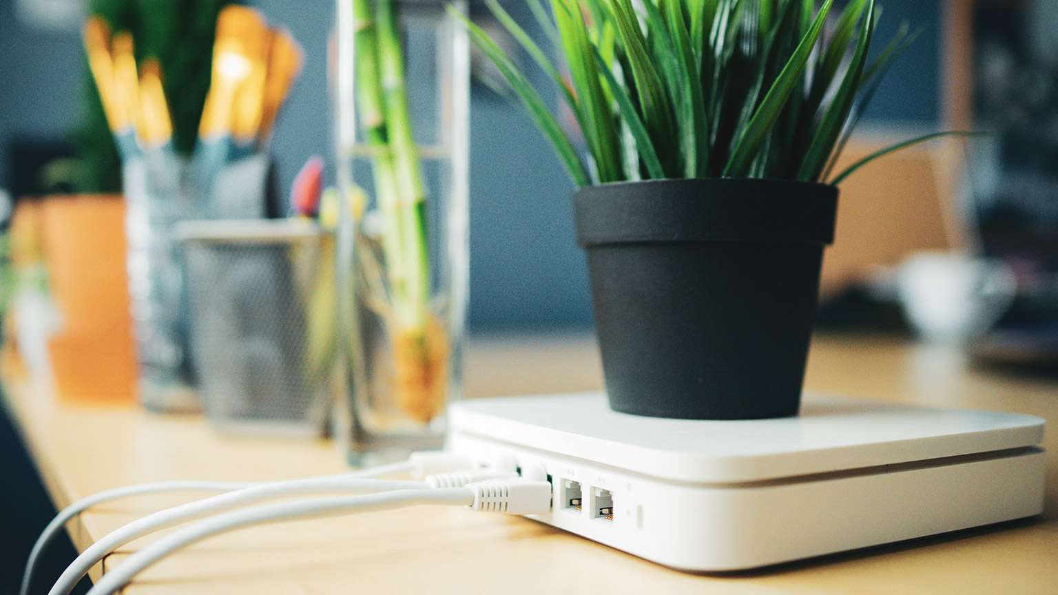 A router sitting on a table in an office