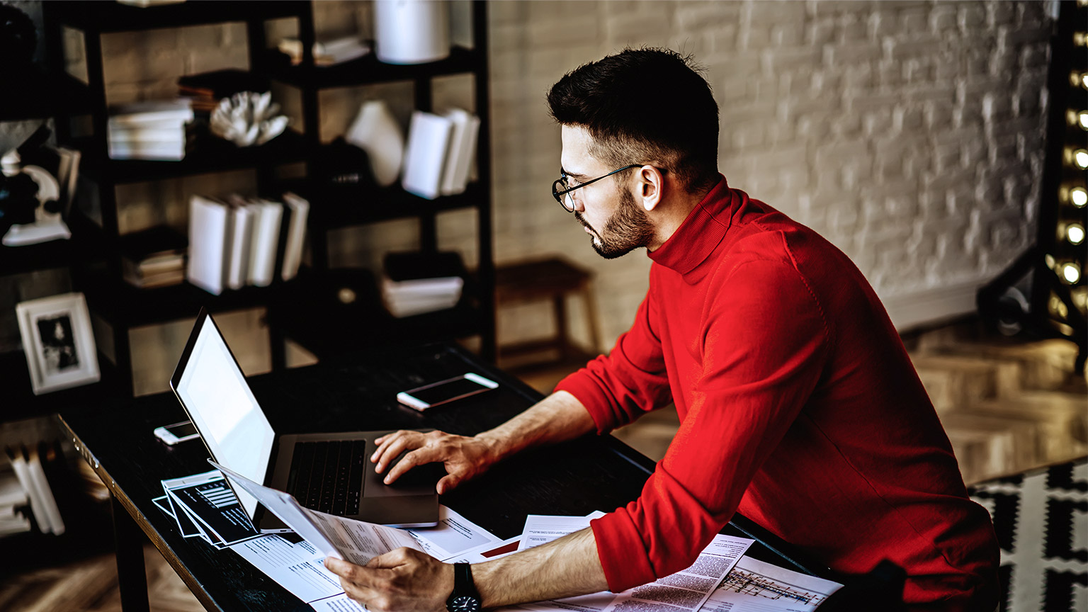 man checking on laptop