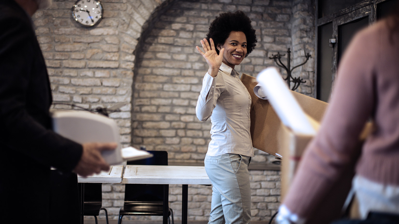 happy woman leaving office