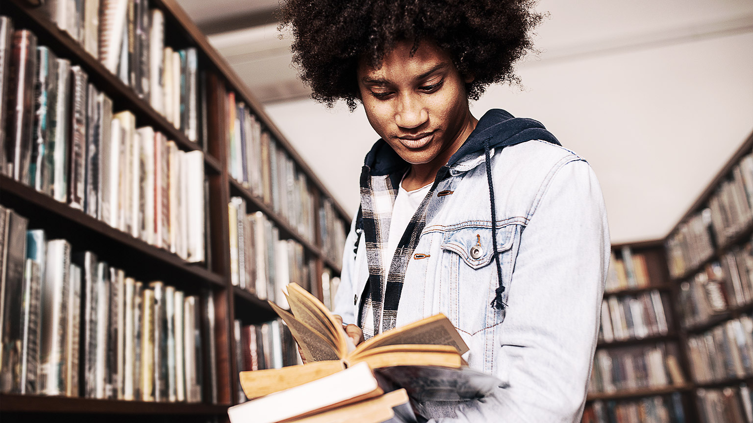 A person reading in a library