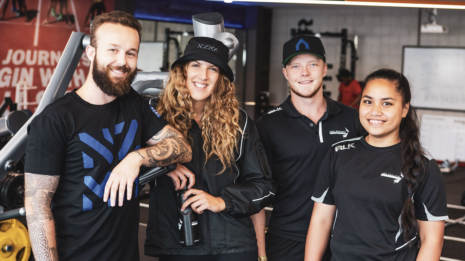 A group of smiling NZIS trainers